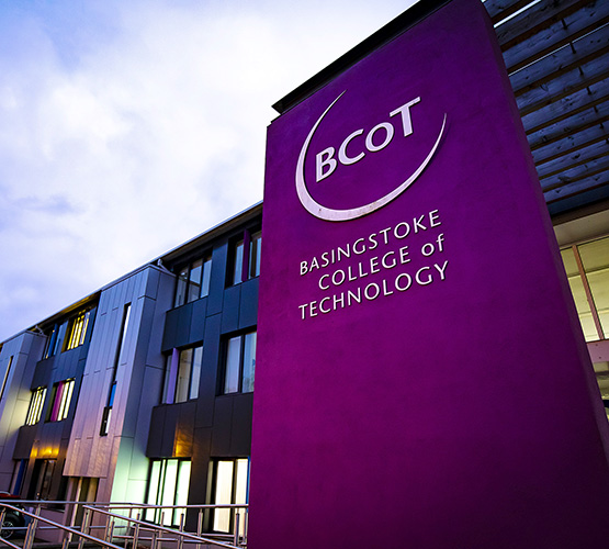 Image of Basingstoke College of Technology from the outside with the sun setting