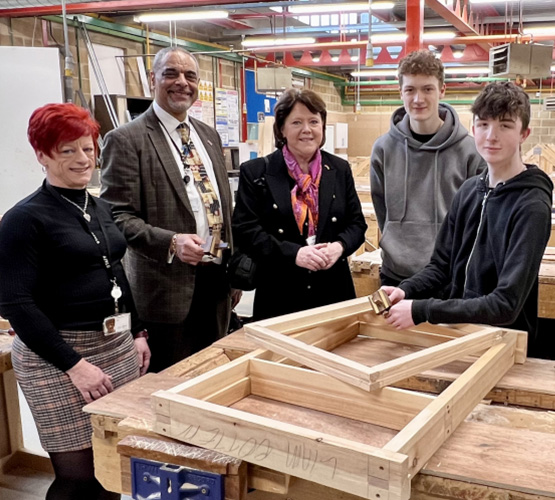 Construction students pose for photo with MP Maria Miller, BCoT Principal Anthony Bravo and Sam Lunn Head of Apprenticeships