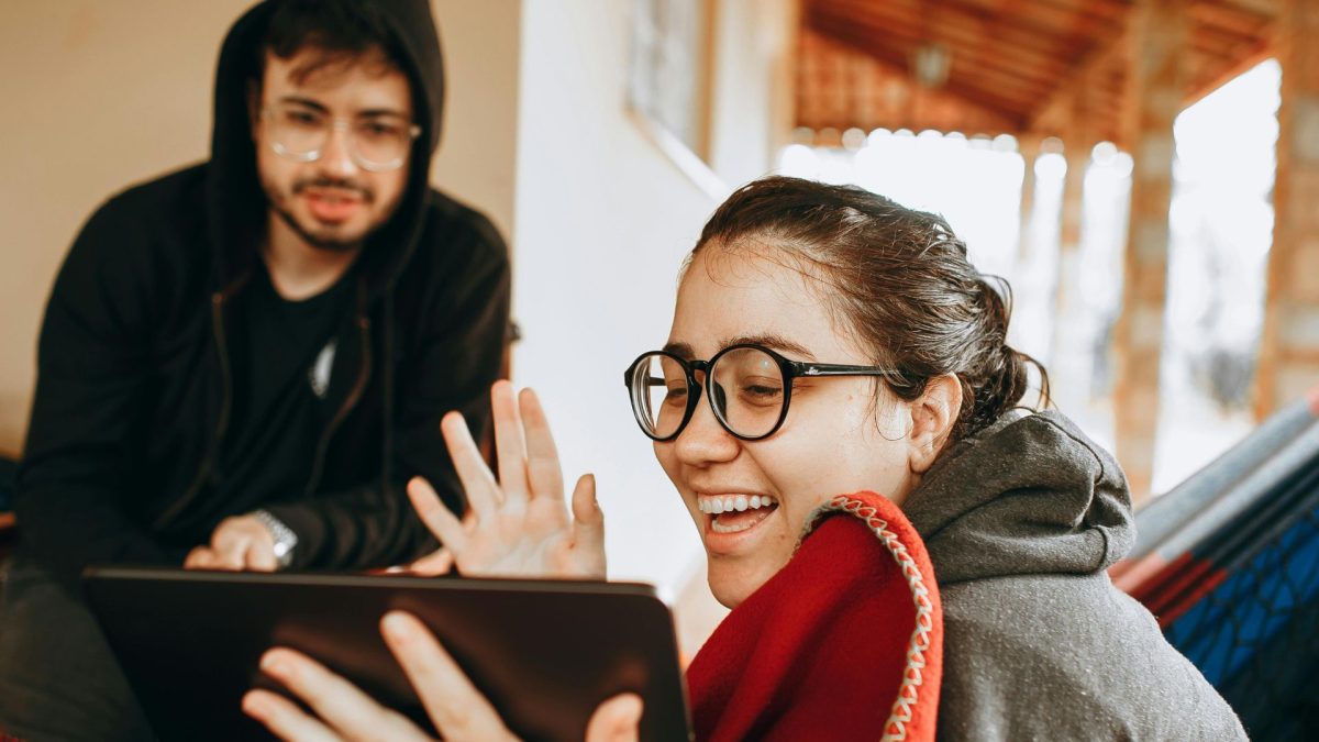 Lady smiling showing the device screen